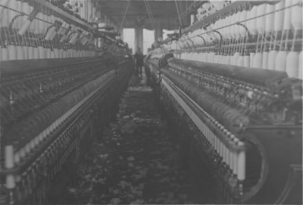 Lewis Wickes Hine, Untitled (Pawtucket, R.I., November, 1912). (For Child Welfare Exhibit 1912-13). Captioned: View in a Pawtucket R.I. cotton mill showing accumulation of lint on floor. The air is full of it too, but photo doesn't show it.", Nov. 1912