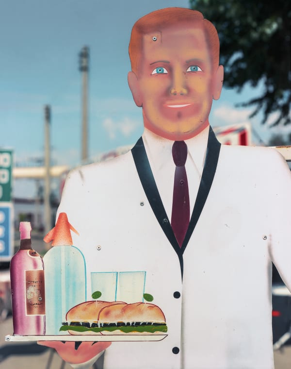 Jim Dow, Detail of Sign of Waiter Carrying Drinks and a Sandwich, Alta Gracia, Cordoba, Argentina, 1989