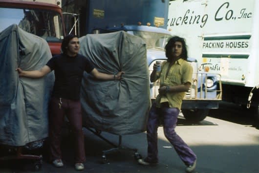 Helen Levitt, Untitled, New York (men with clothing racks, "Trucking Co., Inc."), 1978