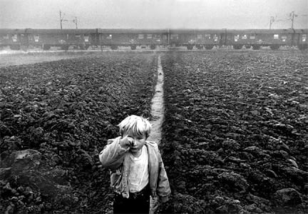 Sebastião Salgado, Croatia (boy rubbing eye, train), 1994/2001