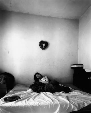 Bruce Davidson, Untitled [young woman on bed with heart on wall], 1966-1968