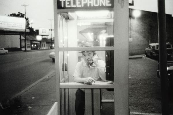 William Eggleston, Untitled, (man in telephone box), 1960-1972