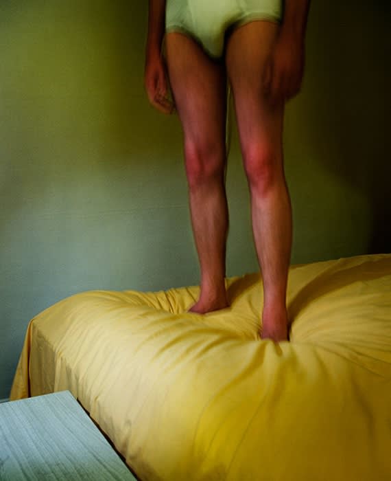 Jo Ann Callis, Untitled, [Man on yellow bed], from Early Color Portfolio, Circa 1976
