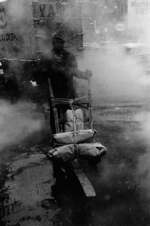 Bruce Davidson, Untitled [man with dolly in snowstorm on street], New York City, A Time of Change, 1962
