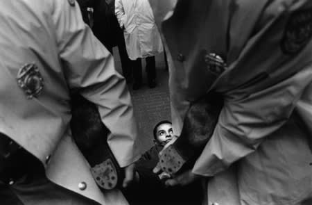Bruce Davidson, Untitled [man's feet held by police as he is dragged], CORE convention at the World's Fair, A Time of Change, 1964
