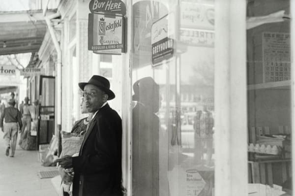 William Eggleston, Untitled, (man and Chesterfield sign), 1960-1972