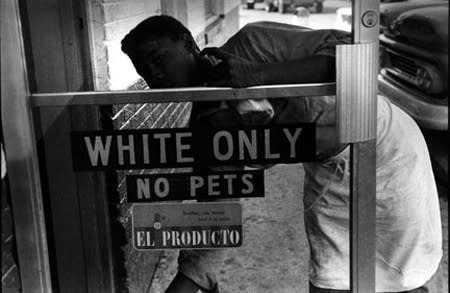 Bruce Davidson, Untitled [cleaning the White Only sign], Hampton, VA, A Time of Change, 1962