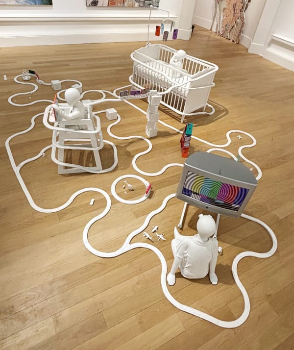 Madeleine Marg iPAD BABY, 2025 Plaster, wood, acrylic, polymer clay, vinyl, repurposed train, toys, cot, highchair, TV, clothes and mannequins Dimensions variable, approx. 175 x 400 x 400 cm