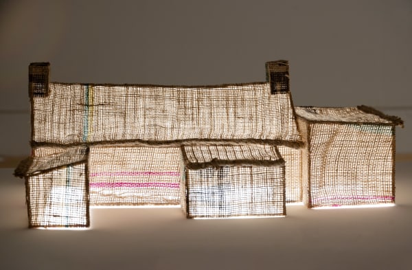 Kirsty Duguid Forty-Four, 2023 Hessian sacks and wooden sticks on MDF plinth with integrated lighting panel Building: 53 x 30 x 21 cm Plinth: 85 x 61 x 45 cm