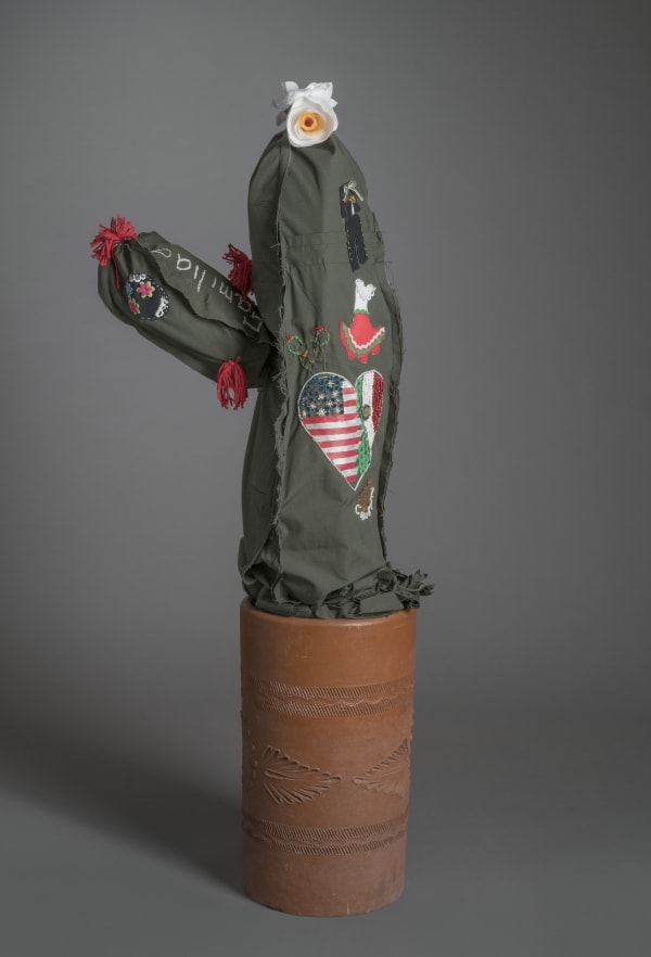 Margarita Cabrera Space in Between: Saguaro (Paola Iniesta), 2016 Border Patrol uniform fabric, copper wire, pvc pipe, foam, thread, and terra cotta pot 53.7 x 18 x 10" 136.5 x 45.7 x 25.4 cm