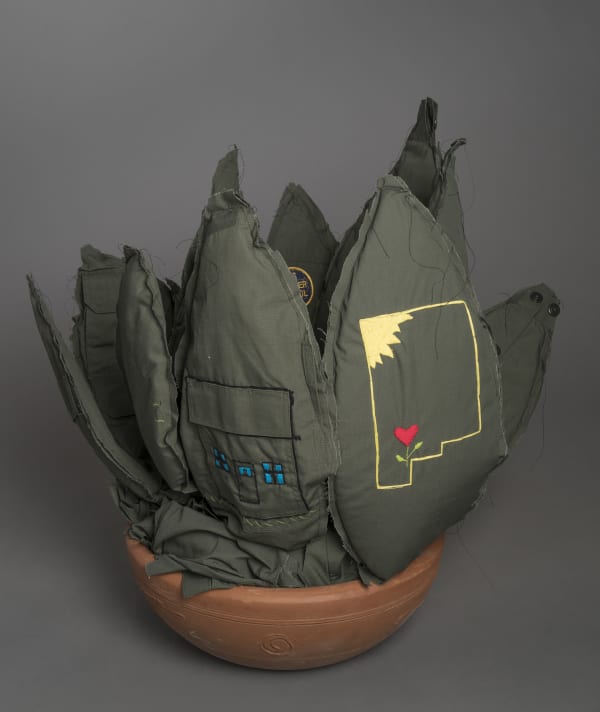 Margarita Cabrera Space in Between: Aloe Vera (Tabatha Jaime), 2016 Border patrol uniform fabric, copper wire, pvc pipe, foam, thread, and terra cotta pot 28 x 40 x 16.5" 71.1 x 101.6 x 41.9 cm