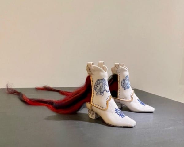 Jennifer Ling Datchuk Giddy Up, 2021 Porcelain and human hair 7 x 3 x 30 in 17.7 x 7.6 x 76.2 cm