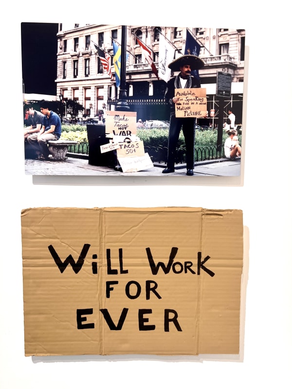 Alejandro Diaz Enchiladas at the Plaza, 2003/2021 Performance/intervention in which hand-painted cardboard signs were sold and distributed to passersby in Manhattan’s Fifth Avenue shopping district. The work consists of a photograph printed on aluminum and a cast resin acrylic painted sign 27.5 x 18 in 69.8 x 45.7 cm Edition 1 of 3 plus 2 AP