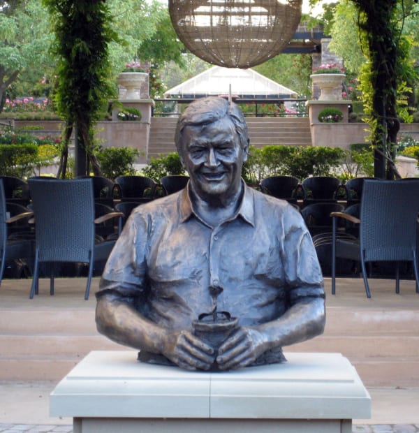 Bronze bust of Bill Roche holding a potted plant, installed at Hunter Valley Gardens, symbolizing his legacy.