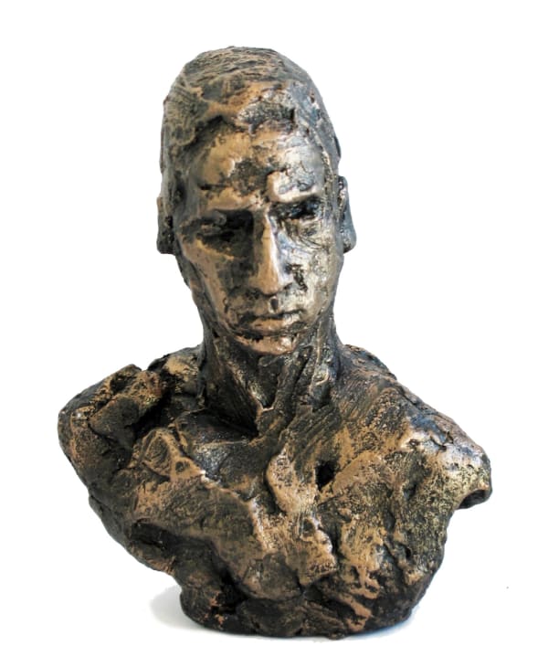 A textured bronze mini bust of a man, approximately 13 cm tall. The sculpture captures an introspective expression with sharp facial features and detailed contours. The rough, organic texture adds depth and character, highlighting the artistry of the piece. The man gazes slightly downward, evoking a contemplative mood.