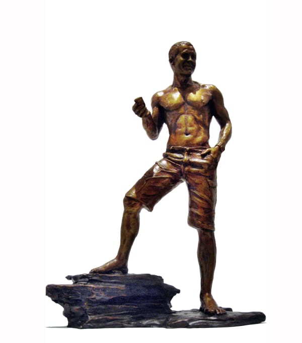 A bronze statuette of Scott, capturing his casual yet confident pose. The figure is shirtless, wearing shorts, and barefoot, standing on a rocky base. The statuette highlights Scott's athletic physique and relaxed demeanor.