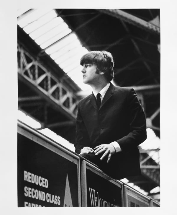 Lord Christopher Thynne, The Beatles, John Lennon sitting on an advertising hoarding at Marylebone Station II. , 1964