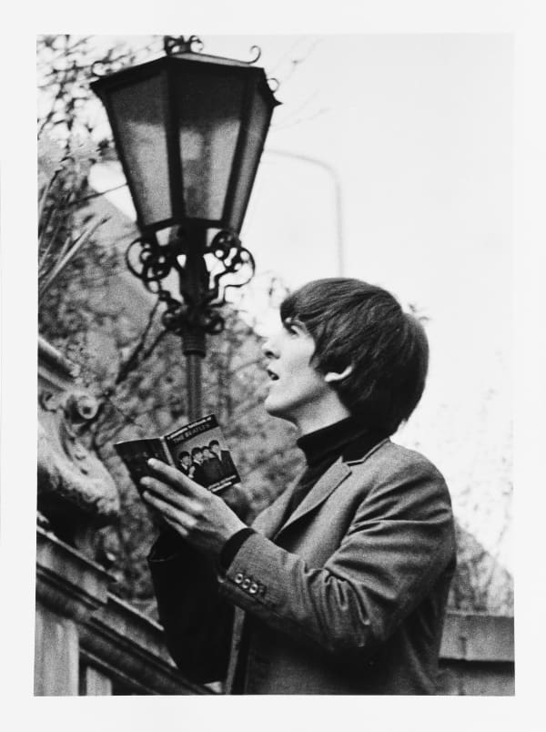 Lord Christopher Thynne, The Beatles, George Harrison signing a book in the walled garden of the Ambassadeurs Club, Mayfair. , 1964/2021