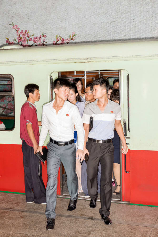 Max Pinckers, People Exiting the Metro at Yonggwang Station, Pyongyang, North Korea, 2017 (from the series of Red ink), 2018
