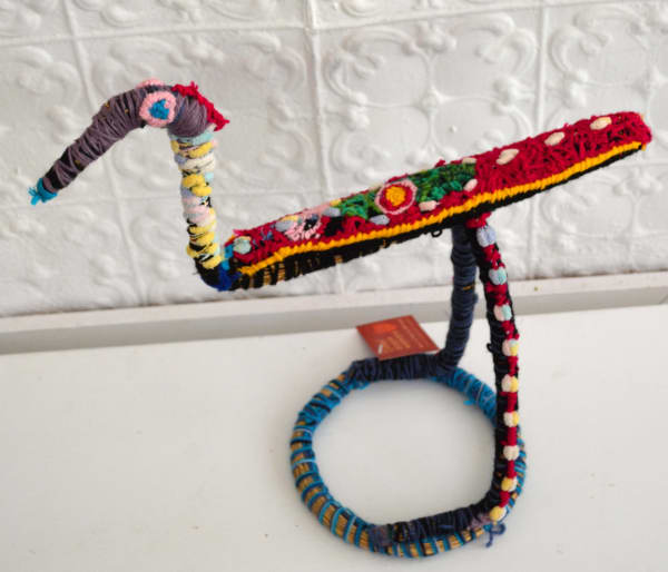 Sheena Dodd Tjulpu (Bird) raffia and minarri (greybeard) grass and wool 34 x 45 x 19 cm