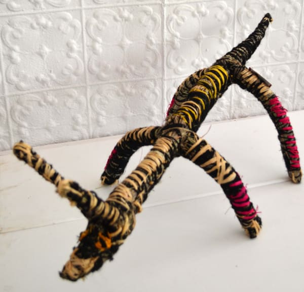 Pauline Minmila Wangin Papa (Dog) raffia and minarri (greybeard) grass and wool 24 x 86 x 34 cm