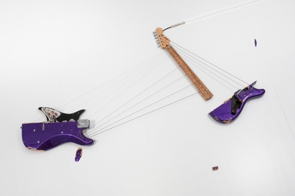 Naama Tsabar Melody of Certain Damage #15, 2022 Broken electric guitar, strings, microphone, screws and amplifier 67 3/4 x 60 x 3 in (with plinth) 172.1 x 152.4 x 7.6 cm (with plinth)