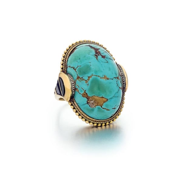 An Egyptian Revival Turquoise, Onyx, and Gold Ring, c. 1910
