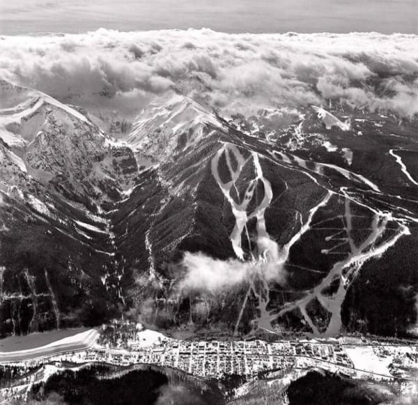Black and white aerial photo of bear creek, the town of telluride, and the telluride ski resort by slate gray gallery artist Bill Ellzey