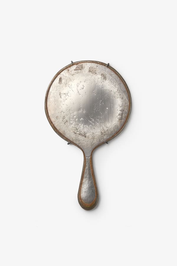 Adi Toch Large round hand mirror (Cloudy), 2023 Speculum metal alloy (white bronze), Oxidised bronze mount 33 H x 19 W x 2 D cm 12.9 H x 7.4 W x 0.7 D in