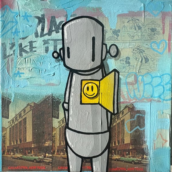 grey robot with an opening in his chest that contains a yellow smiley face