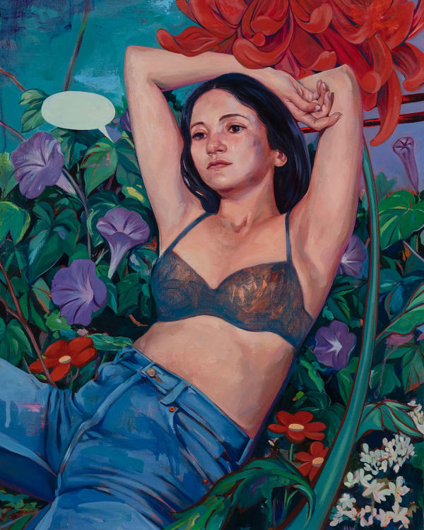 woman in bra and jeans reclining over a bed of flowers