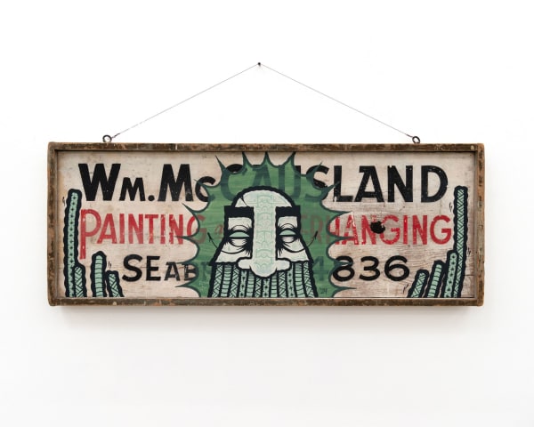 GATS character painted on a wooden sign with black and red writing