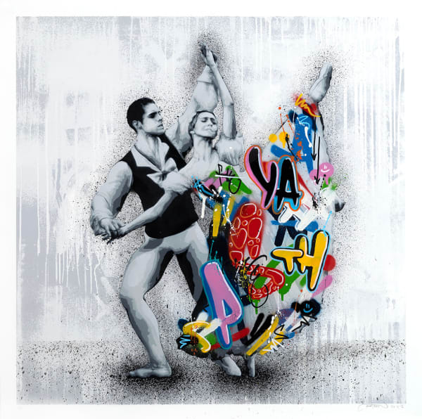 two dancers holding a pose, the man in black and white and the woman in a colorful graffiti design skirt
