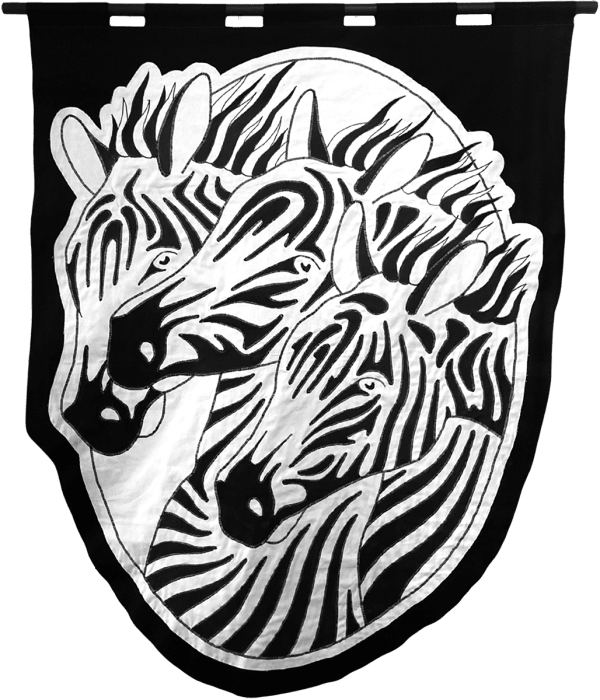 embroidered black and white banner of three zebra