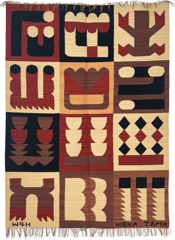 red, tan and black knit rug decorated with abstract symbols