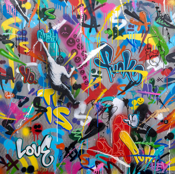 black and white man climbing through graffiti text