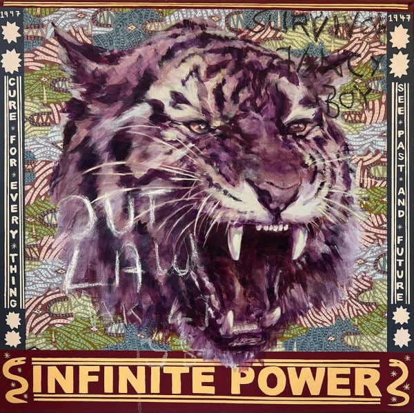 Painting of a tiger with the words "Infinite Power" in yellow letters underneath its head.