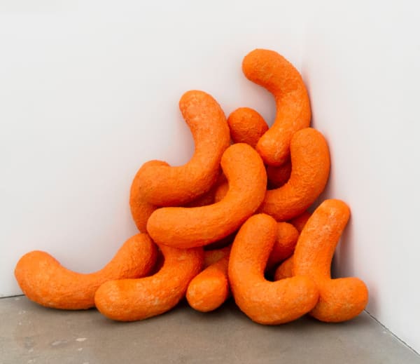 Sam Keller sculpture of larger than life orange Cheetos snacks