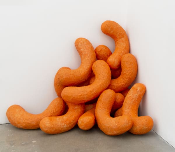 Sam Keller sculpture of larger than life orange Cheetos snacks