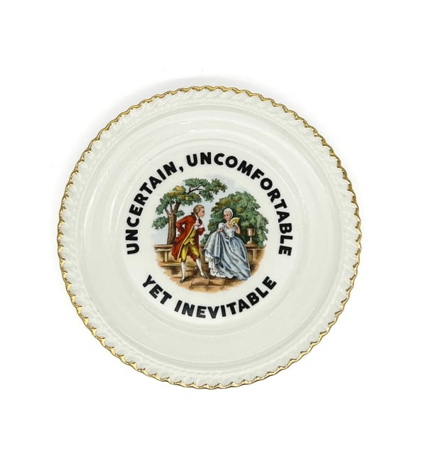 ceramic plates with words painted on them