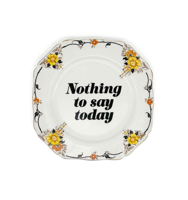 ceramic plates with words painted on them