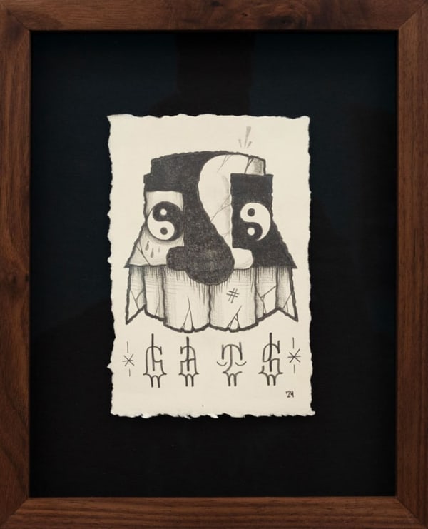 Drawing on paper of a GATS character with yin yang symbols for eyes and designed on its face