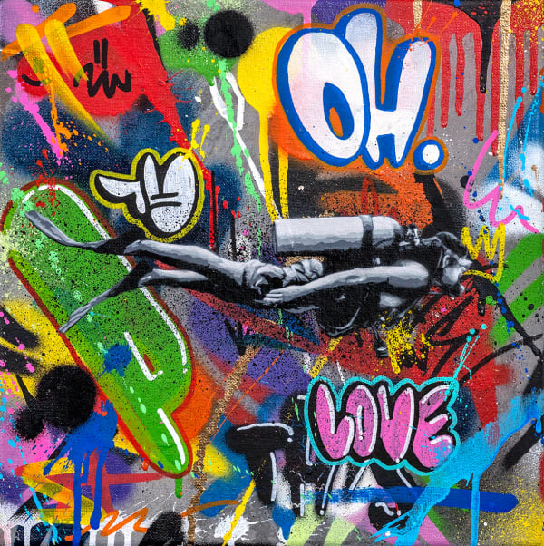 black and white scuba diver swimming through colorful graffiti designs
