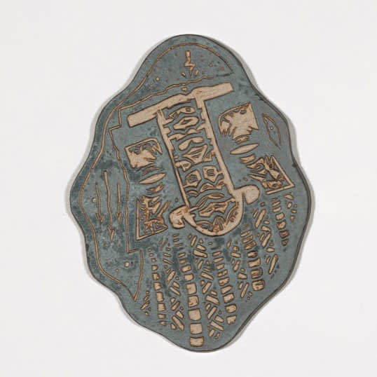 grey tone slab sculpture made depicting abstract symbols and design