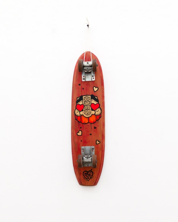Red vintage wooden skateboard with GATS character with red hearts for eyes painted on the bottom of it