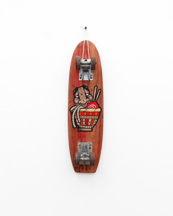 Brown wooden vintage skateboard with GATS character in a bowl of ramen with chopsticks painted on the bottom of the board