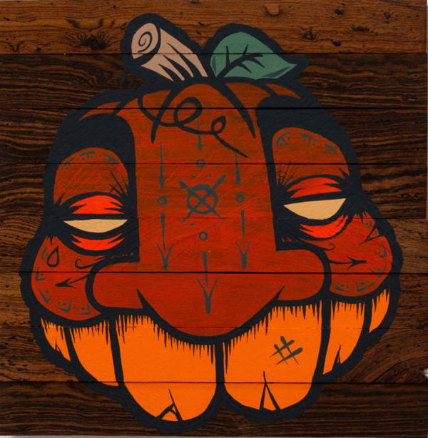 GATS character painted like a pumpkin on a wooden background