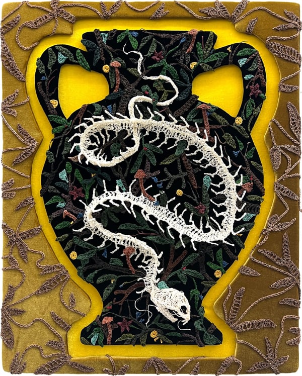 textile artwork of a snake skeleton over a large urn