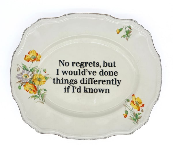 ceramic plates with words painted on them