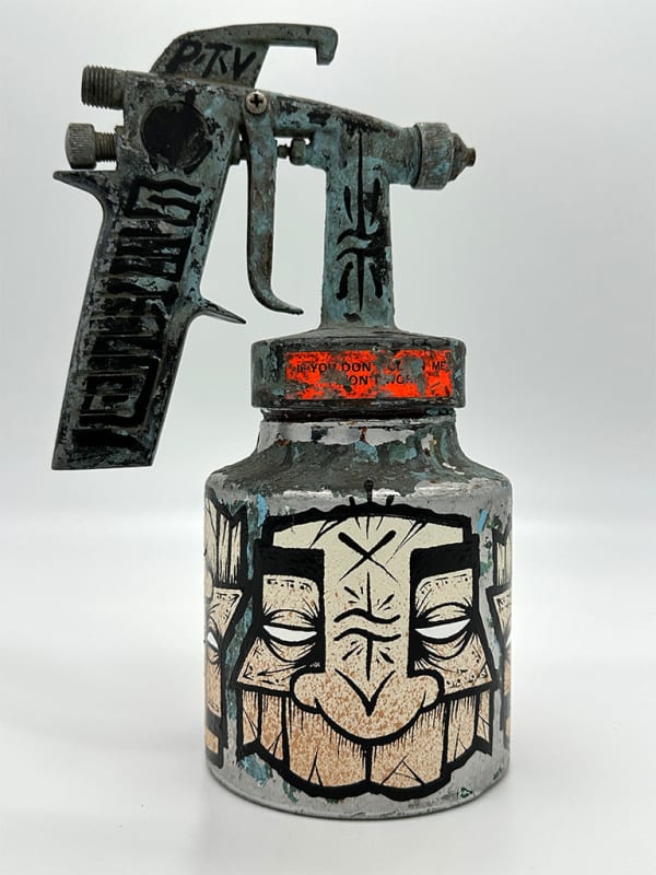 spray paint can decorated with GATS masks